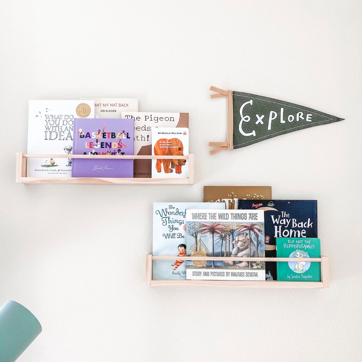 Two wooden bookshelves adorned with neutral-themed decor, creating a cozy and versatile display in any room.