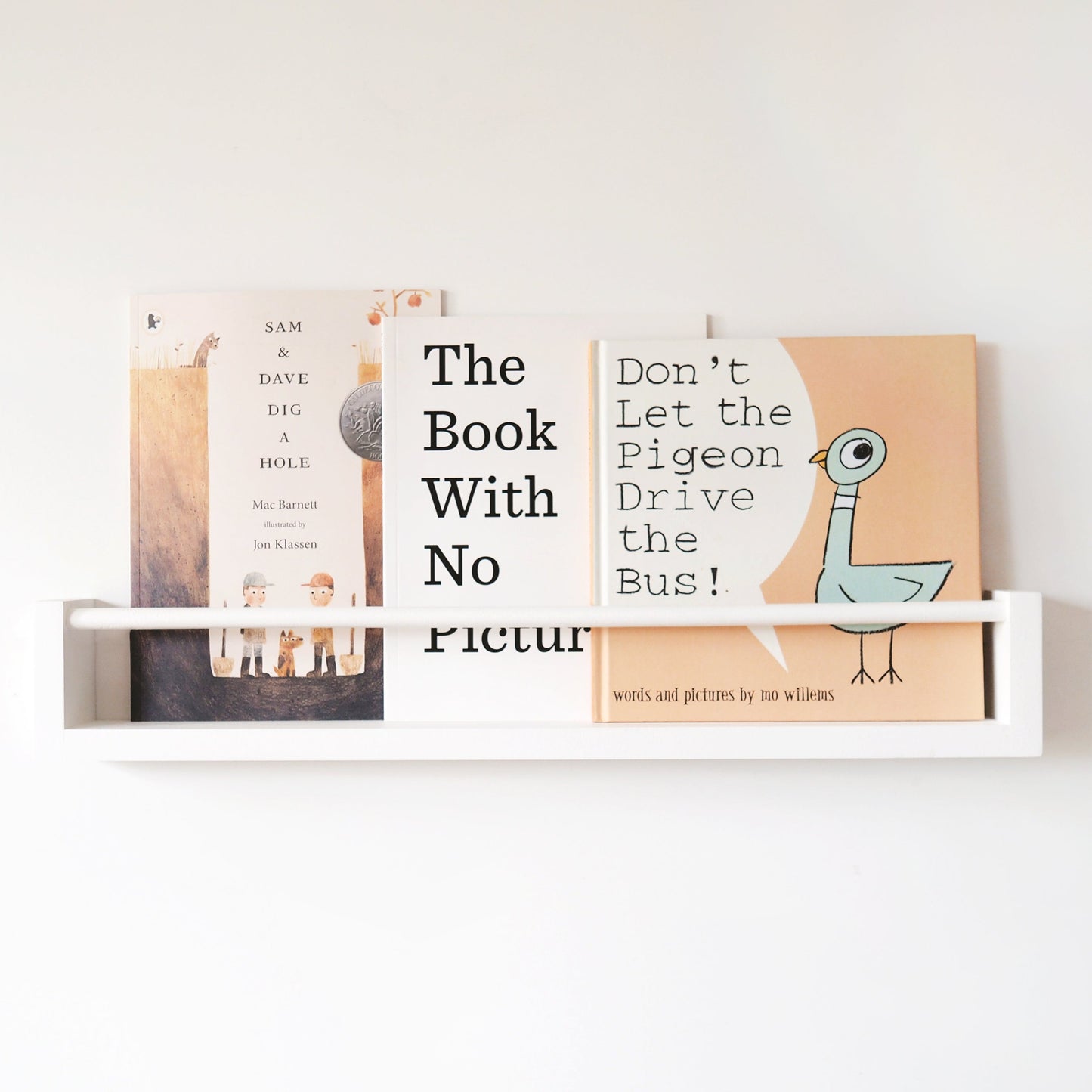 Minimalist white nursery wooden bookshelf made from premium pine wood, offering a stylish and functional storage solution for baby books, seamlessly integrating into any nursery decor with a clean and modern aesthetic